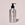 Acure body wash bottle on a light pink background